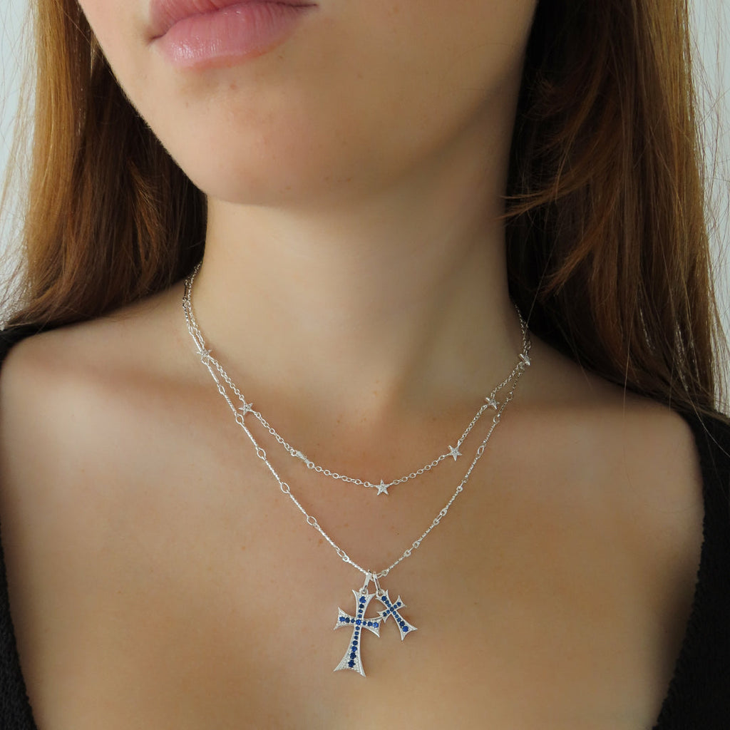 Double strand necklace with blue stone accents in a gold tone finish