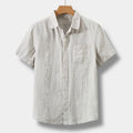 Men's beige short-sleeve classic shirt with chest pocket and a relaxed, elegant cut