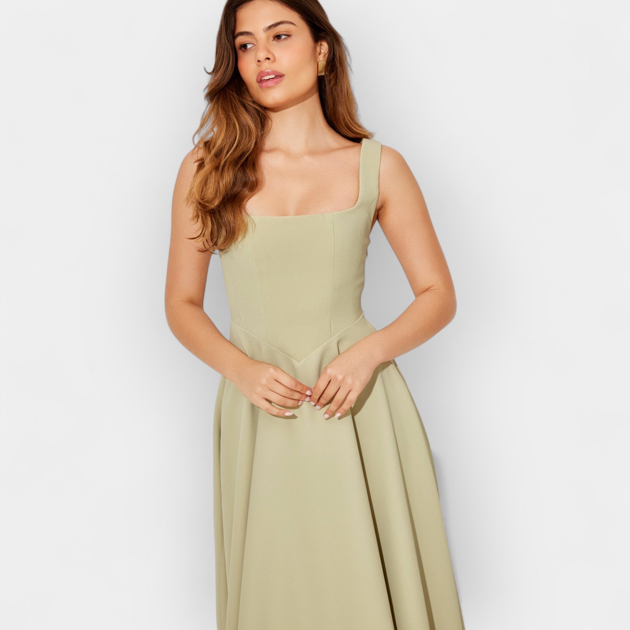 Elegant white midi A-line dress with a square neckline and flowing feminine skirt