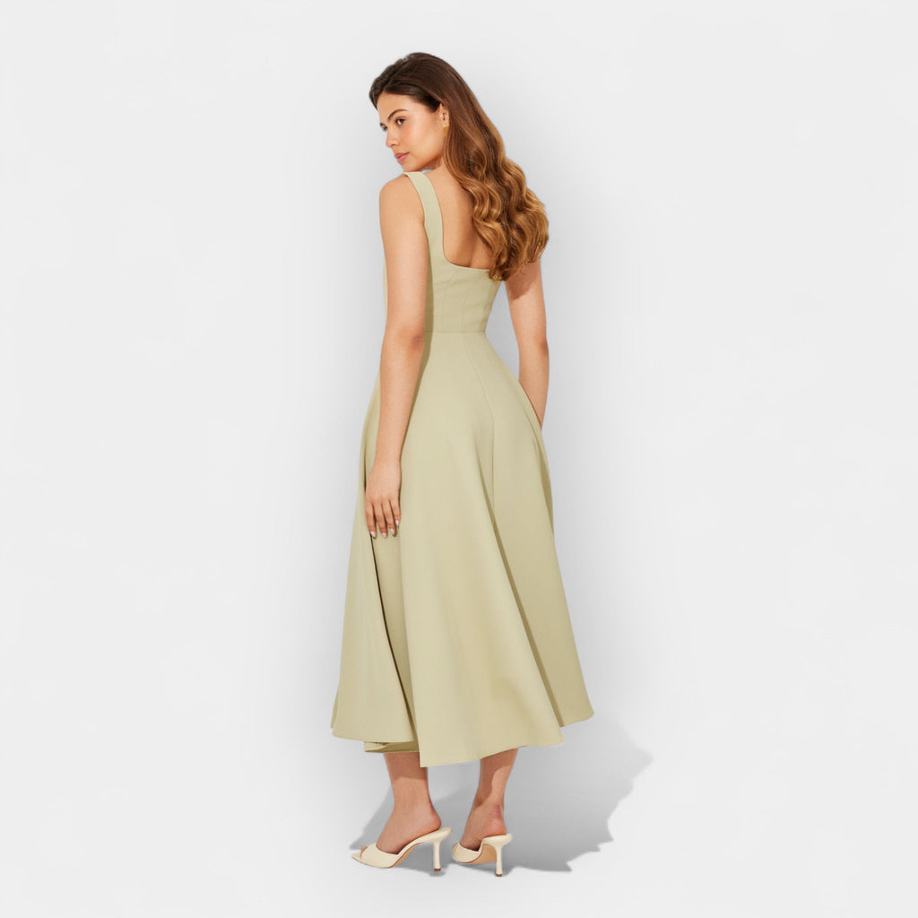 Elegant white midi A-line dress with a square neckline and flowing feminine skirt