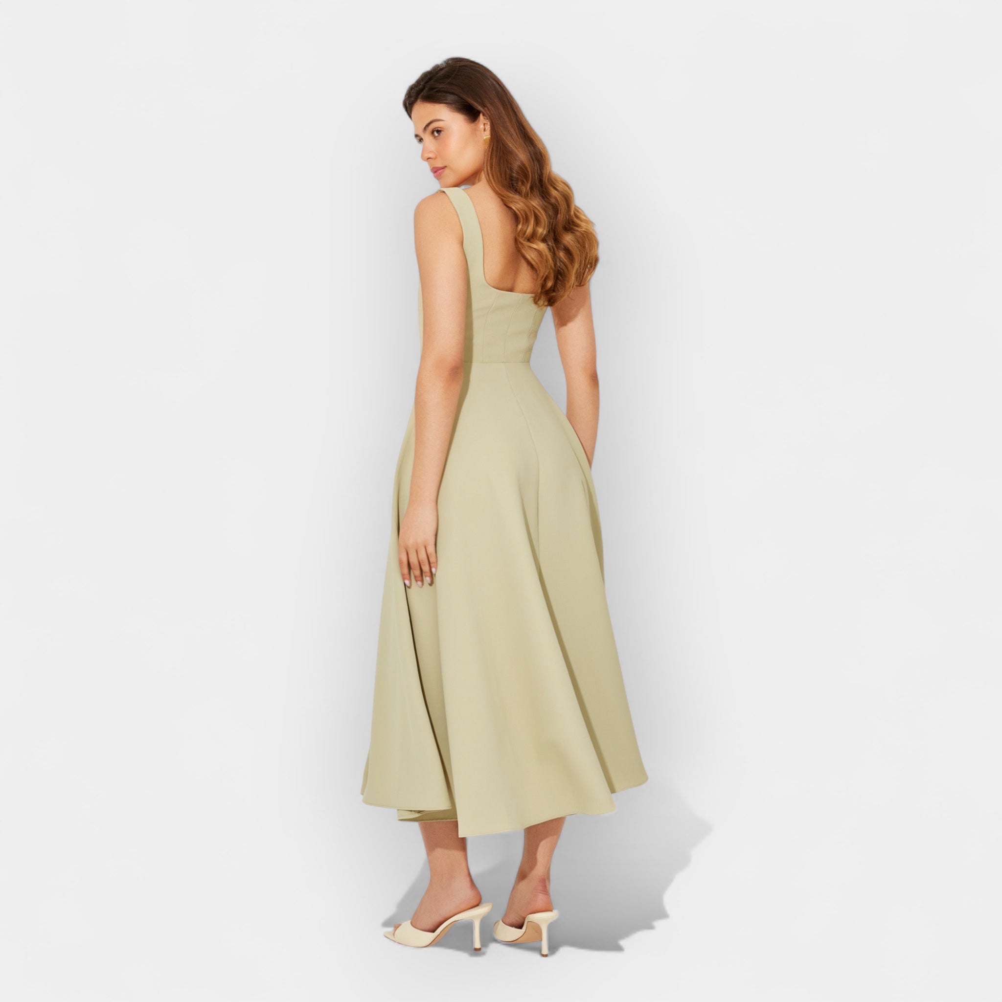 Elegant white midi A-line dress with a square neckline and flowing feminine skirt