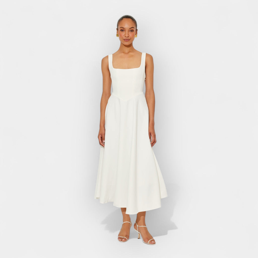 Elegant white midi A-line dress with a square neckline and flowing feminine skirt