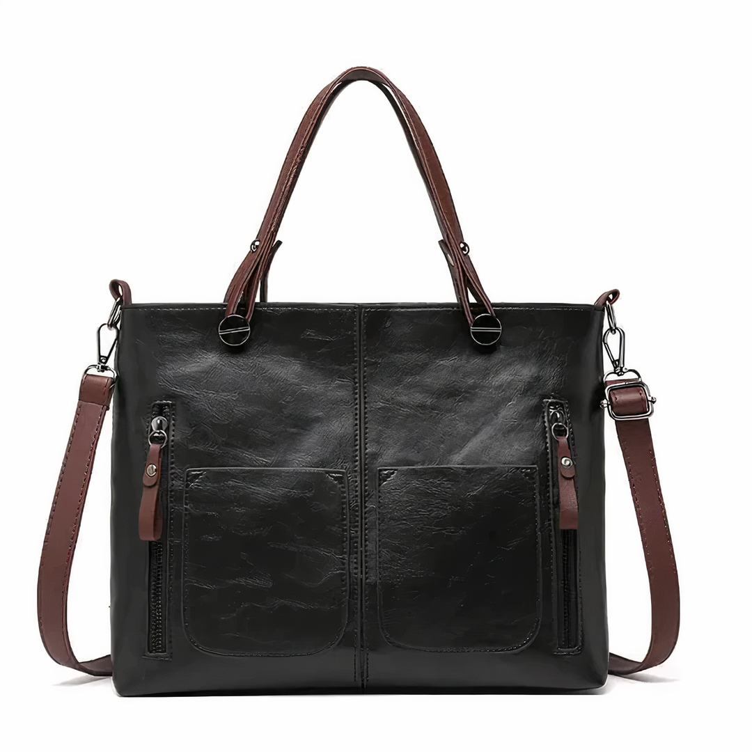 A woman holding a versatile classic handbag with a rich finish by her side