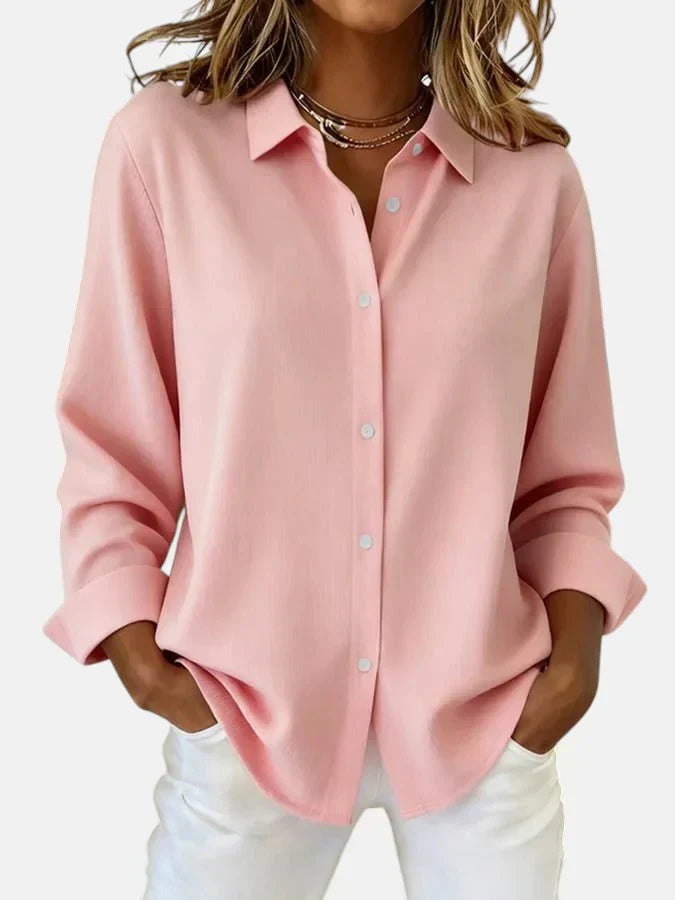 Women's classic button-up blouse in bright fuchsia with a neat collar and relaxed fit