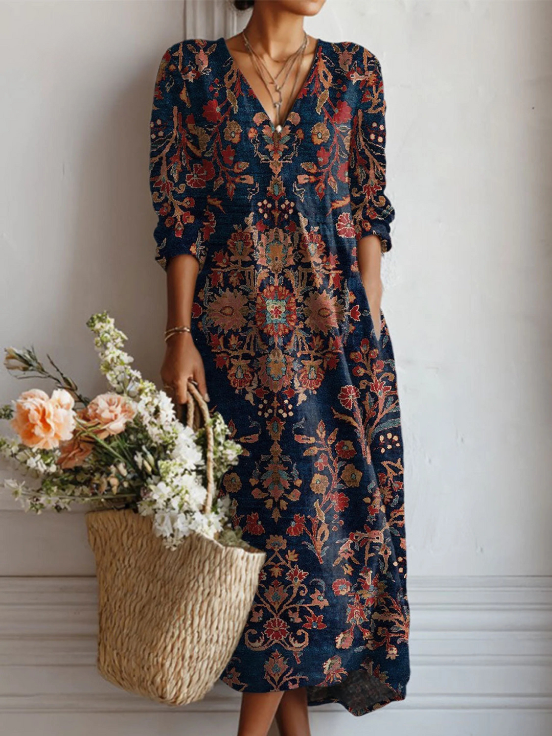 A woman wearing a light, easy day dress with pockets, relaxed and elegant out and about.