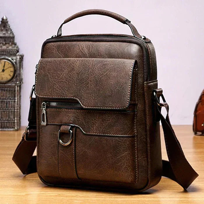 A woman carrying a roomy light brown practical handbag on her shoulder during a busy day out.