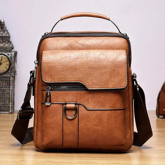 A woman carrying a roomy light brown practical handbag on her shoulder during a busy day out.