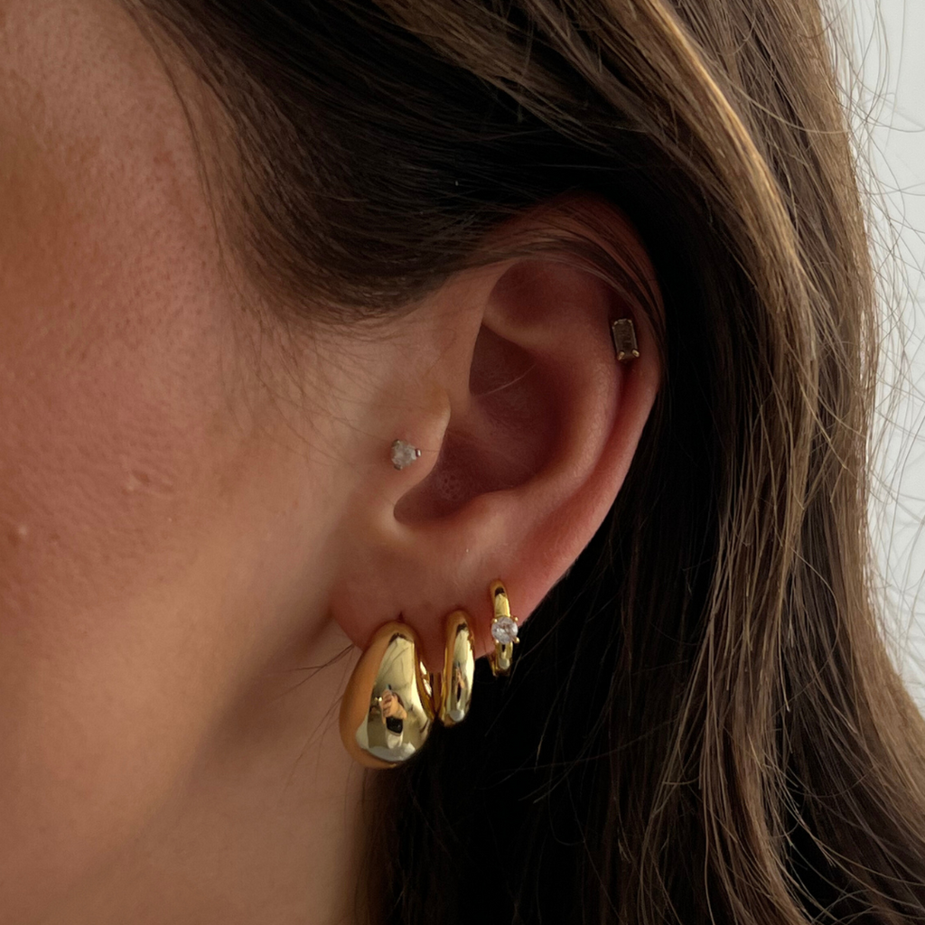Gold statement drop earrings with polished elegant finish