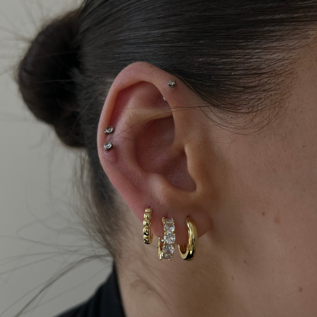 Gold statement drop earrings with polished elegant finish