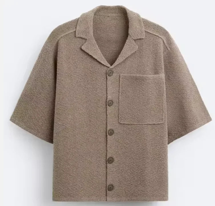 Men's relaxed-fit heritage shirt in a light neutral tone with a fluid drape