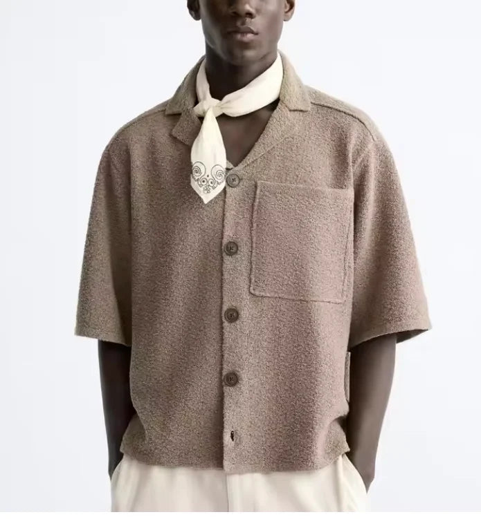 Men's relaxed-fit heritage shirt in a light neutral tone with a fluid drape