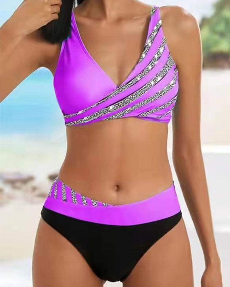 High-waist bikini with a baroque print in warm gold and jewel tones