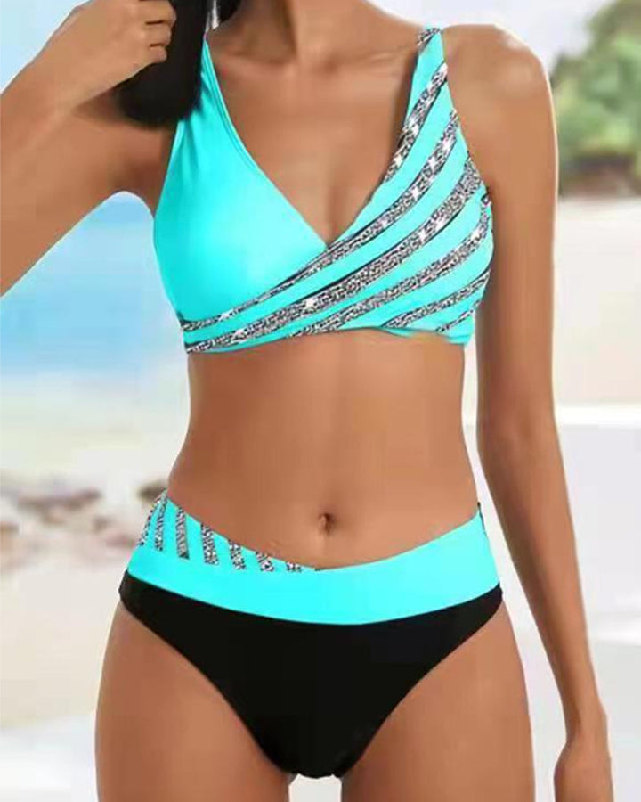 High-waist bikini with a baroque print in warm gold and jewel tones