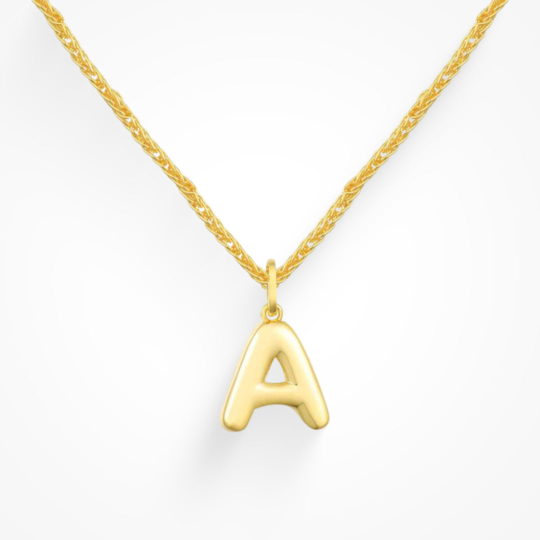 Layering necklace in gold and silver tones displayed on a clean background