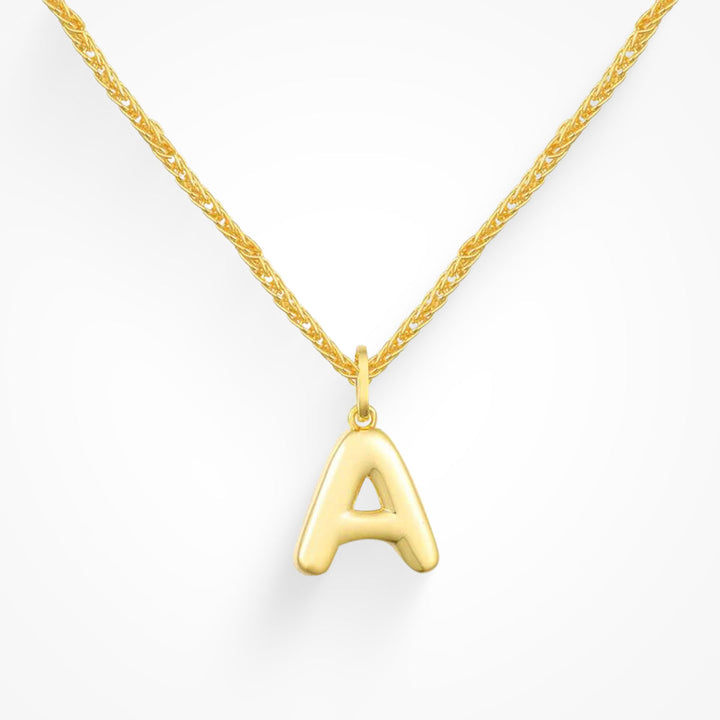 Layering necklace in gold and silver tones displayed on a clean background