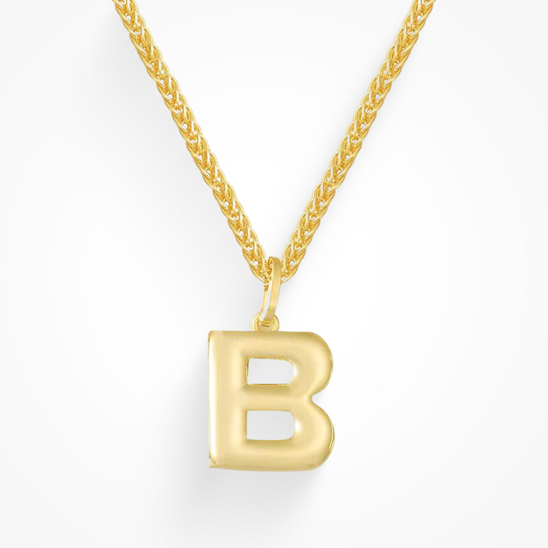 Layering necklace in gold and silver tones displayed on a clean background