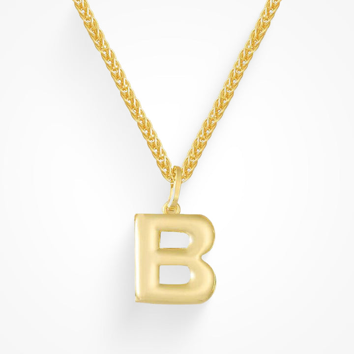 Layering necklace in gold and silver tones displayed on a clean background