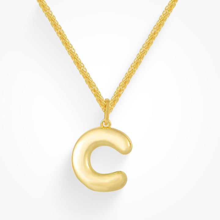 Layering necklace in gold and silver tones displayed on a clean background
