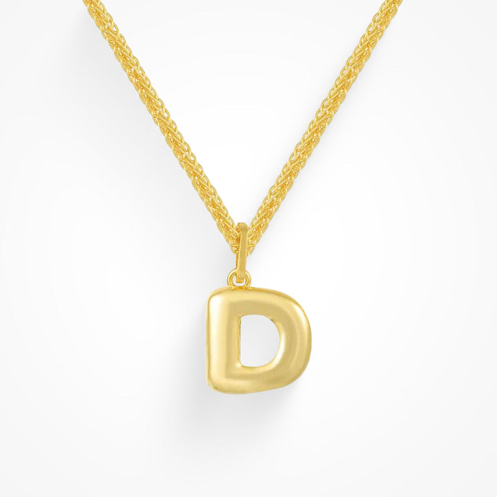 Layering necklace in gold and silver tones displayed on a clean background