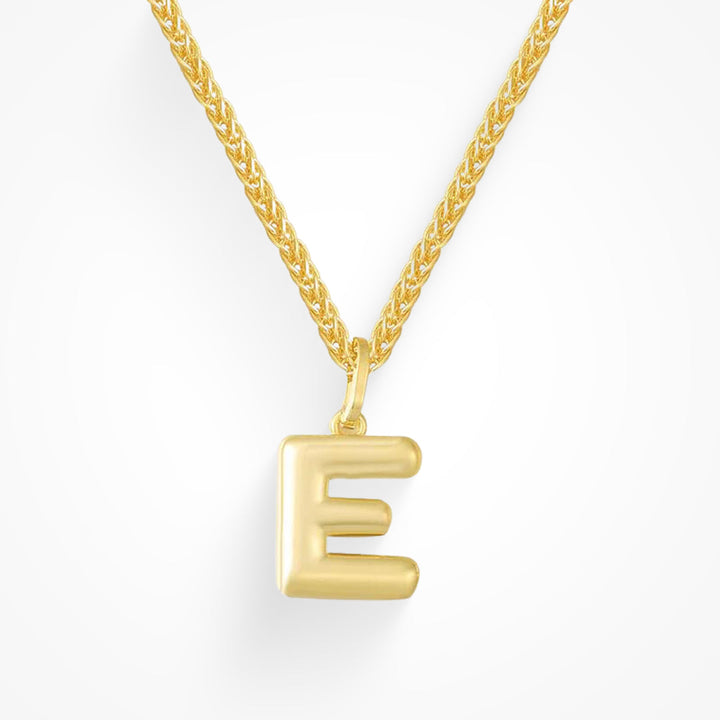 Layering necklace in gold and silver tones displayed on a clean background