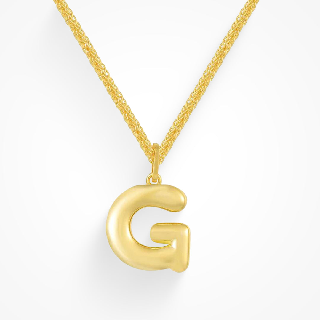 Layering necklace in gold and silver tones displayed on a clean background