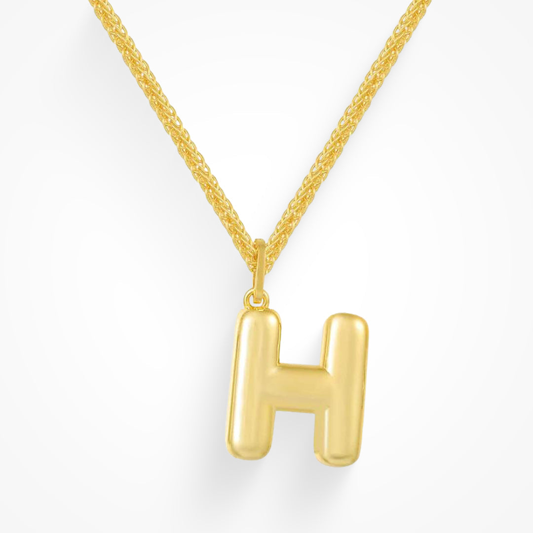 Layering necklace in gold and silver tones displayed on a clean background