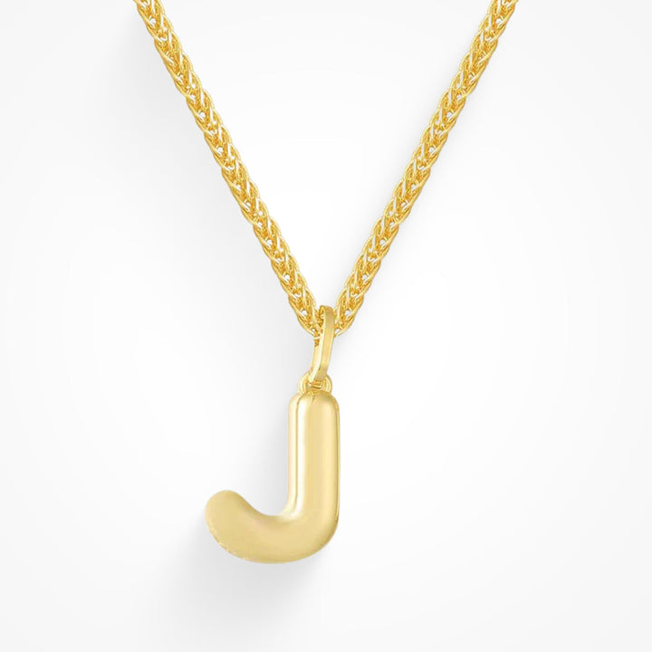 Layering necklace in gold and silver tones displayed on a clean background
