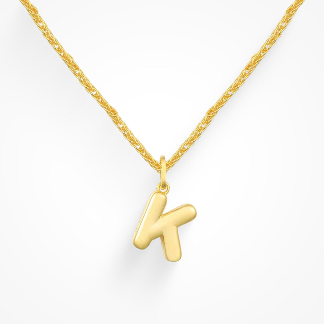 Layering necklace in gold and silver tones displayed on a clean background