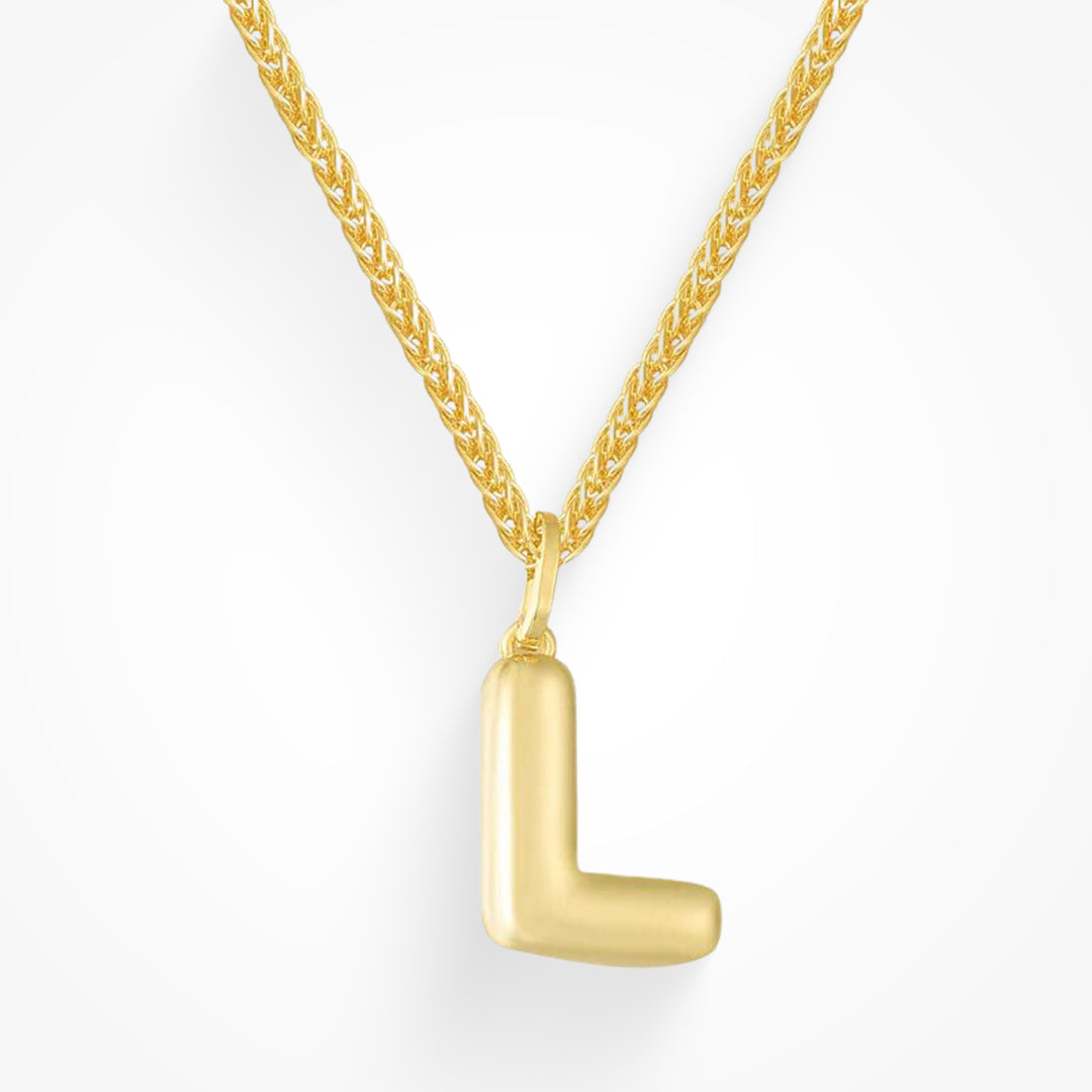 Layering necklace in gold and silver tones displayed on a clean background