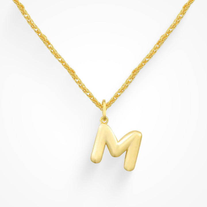 Layering necklace in gold and silver tones displayed on a clean background