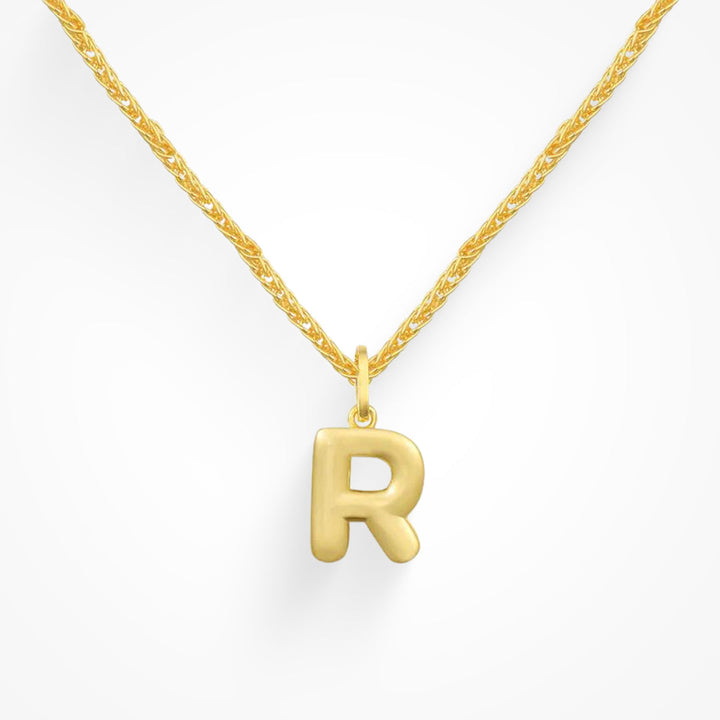 Layering necklace in gold and silver tones displayed on a clean background
