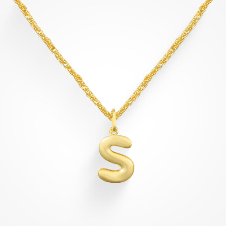Layering necklace in gold and silver tones displayed on a clean background