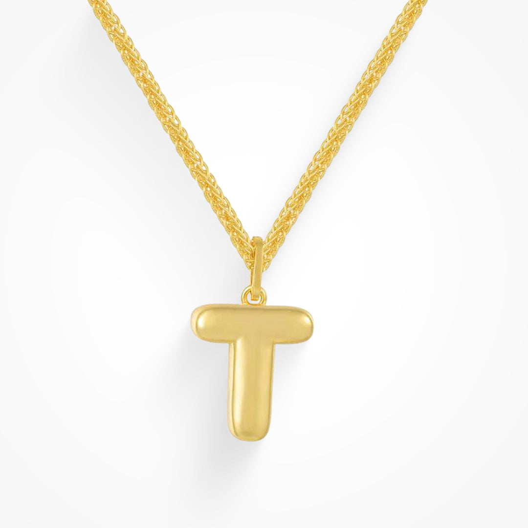 Layering necklace in gold and silver tones displayed on a clean background