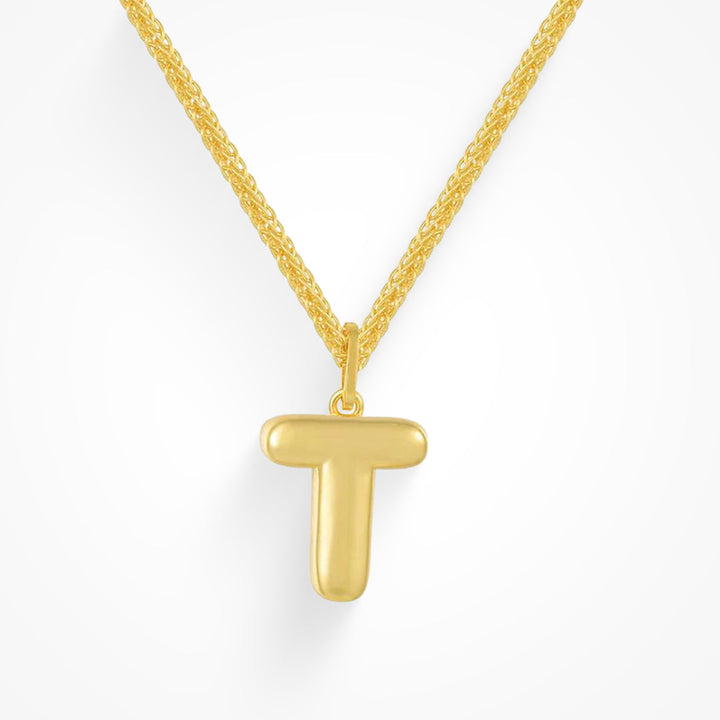 Layering necklace in gold and silver tones displayed on a clean background