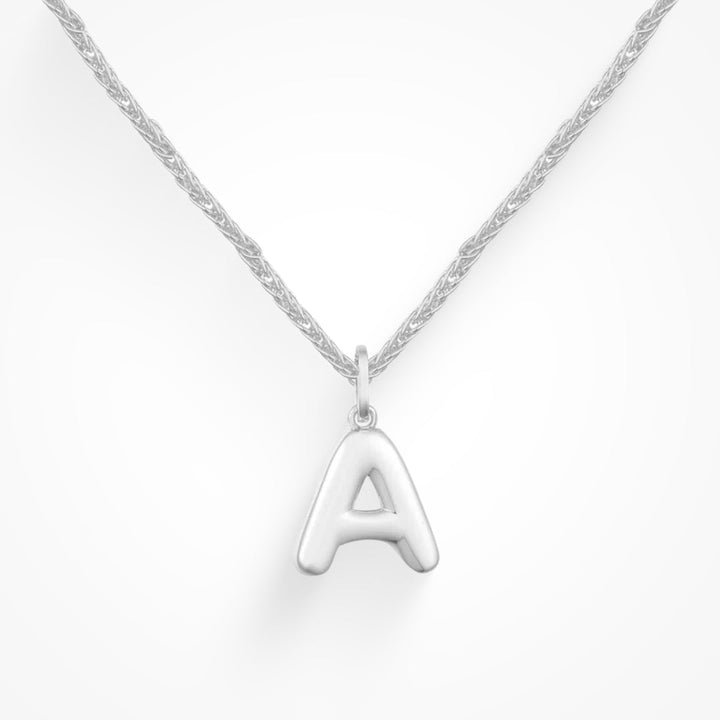 Layering necklace in gold and silver tones displayed on a clean background