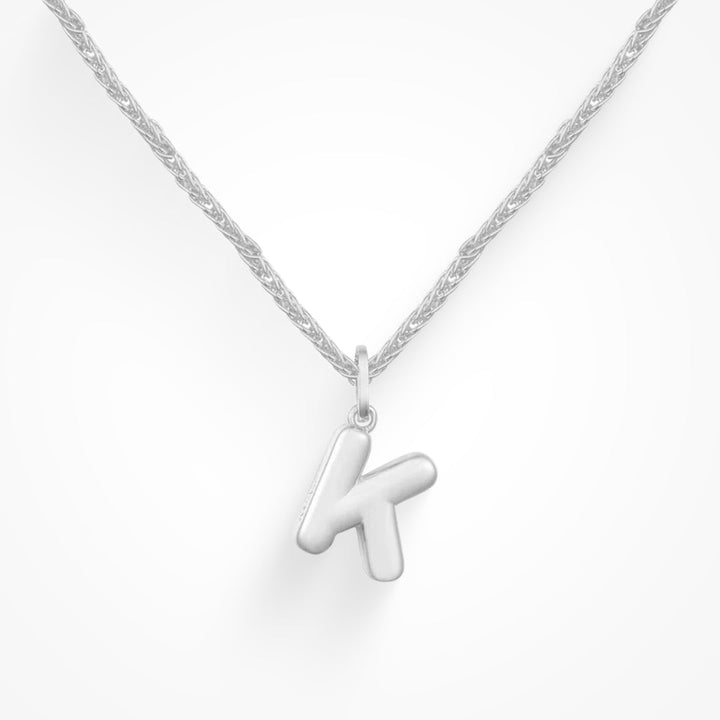 Layering necklace in gold and silver tones displayed on a clean background