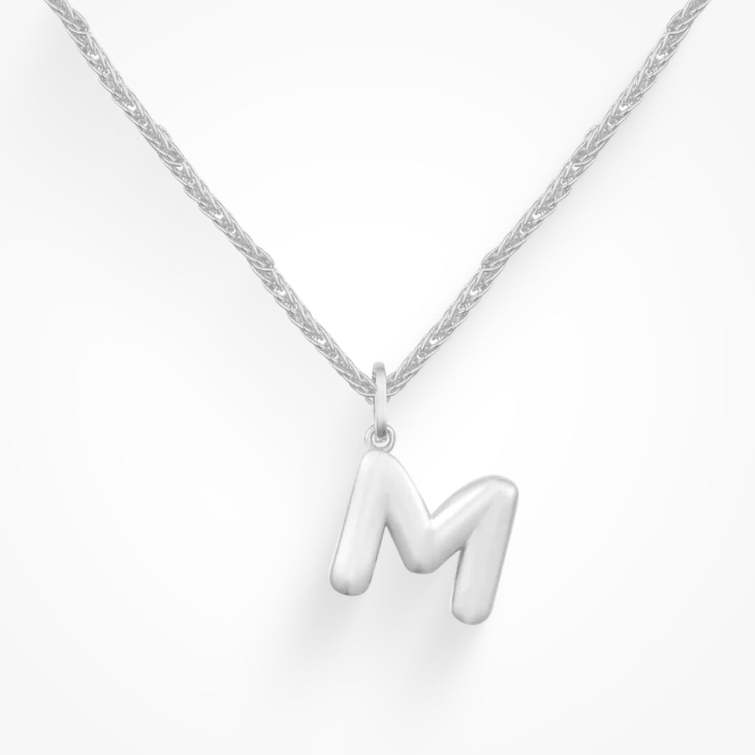 Layering necklace in gold and silver tones displayed on a clean background