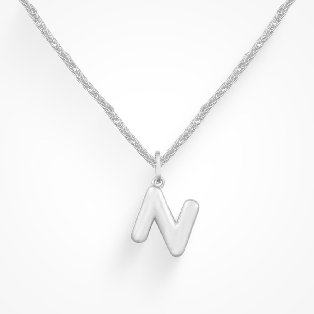 Layering necklace in gold and silver tones displayed on a clean background