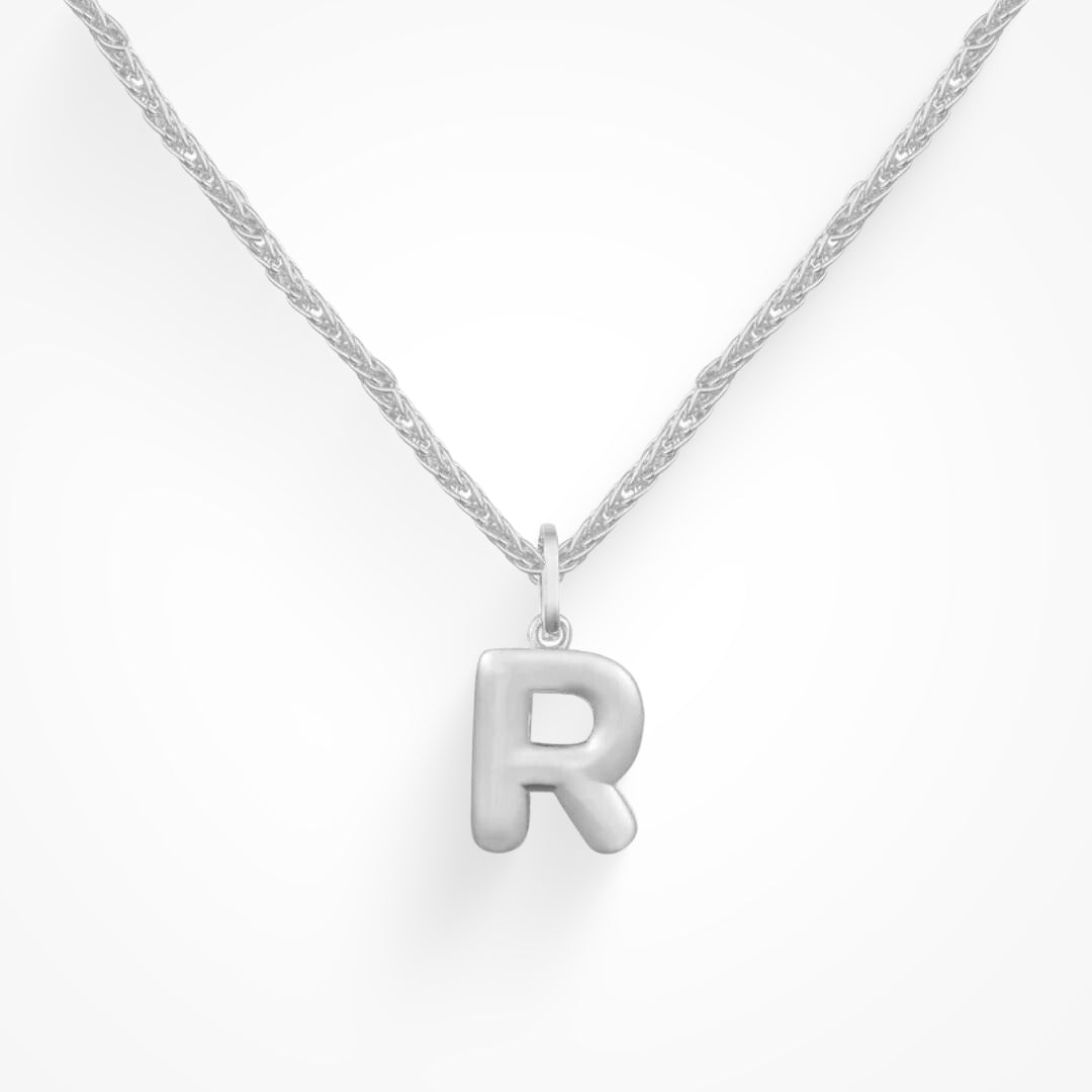 Layering necklace in gold and silver tones displayed on a clean background