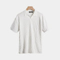 Men's white textured polo shirt with classic collar and clean structured fit
