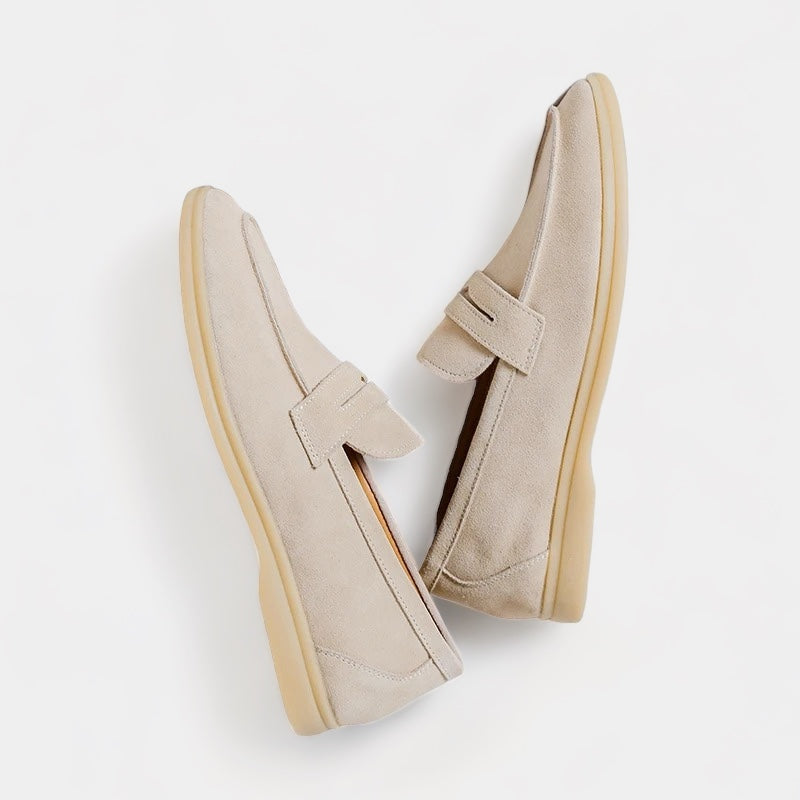 Men's classic slip-on loafers in beige and black with a neat, timeless silhouette