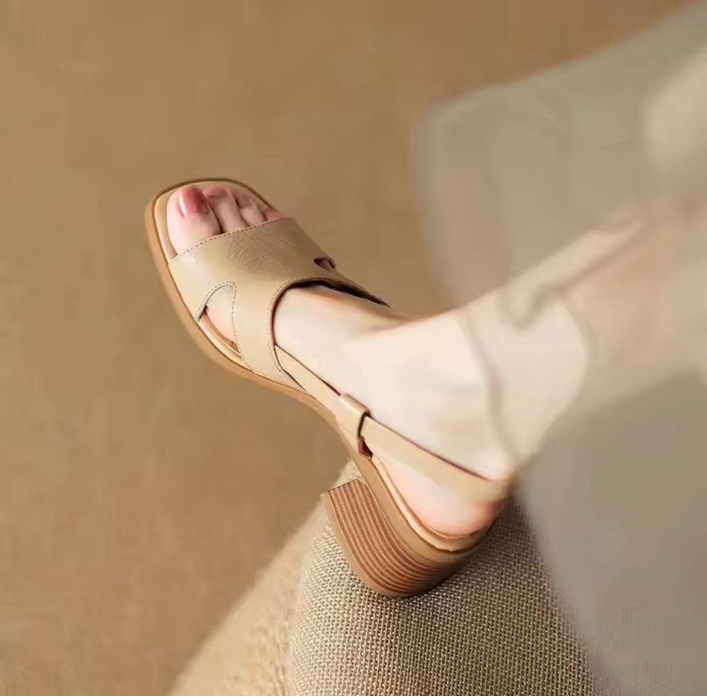 Apricot slingback heels with a single clean strap and wide block heel