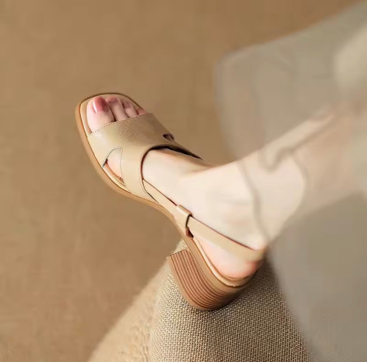 Apricot slingback heels with a single clean strap and wide block heel