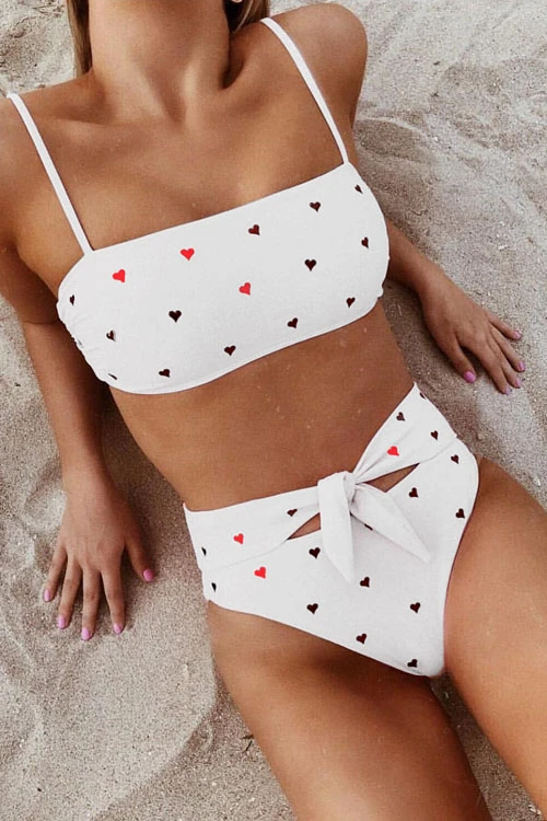 Pink heart-print high-waist bikini set with adjustable tie detail and straight-cut top