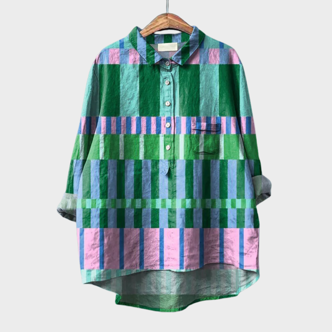 Woman wearing a colourful multicolour checked summer blouse with a soft, airy drape.
