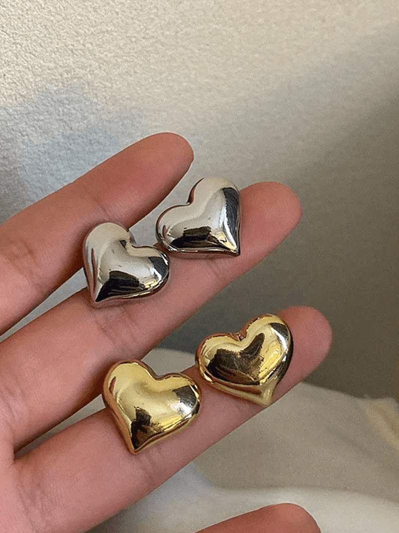 Delicate gold heart-shaped stud earrings