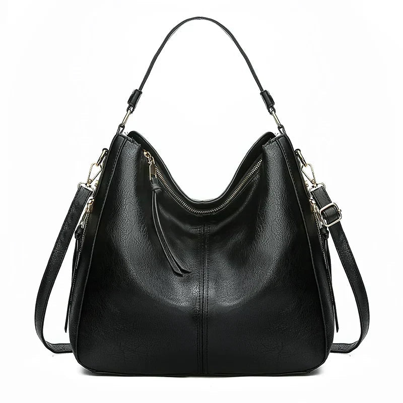 A woman holding a timeless classic handbag with a rich finish by her side