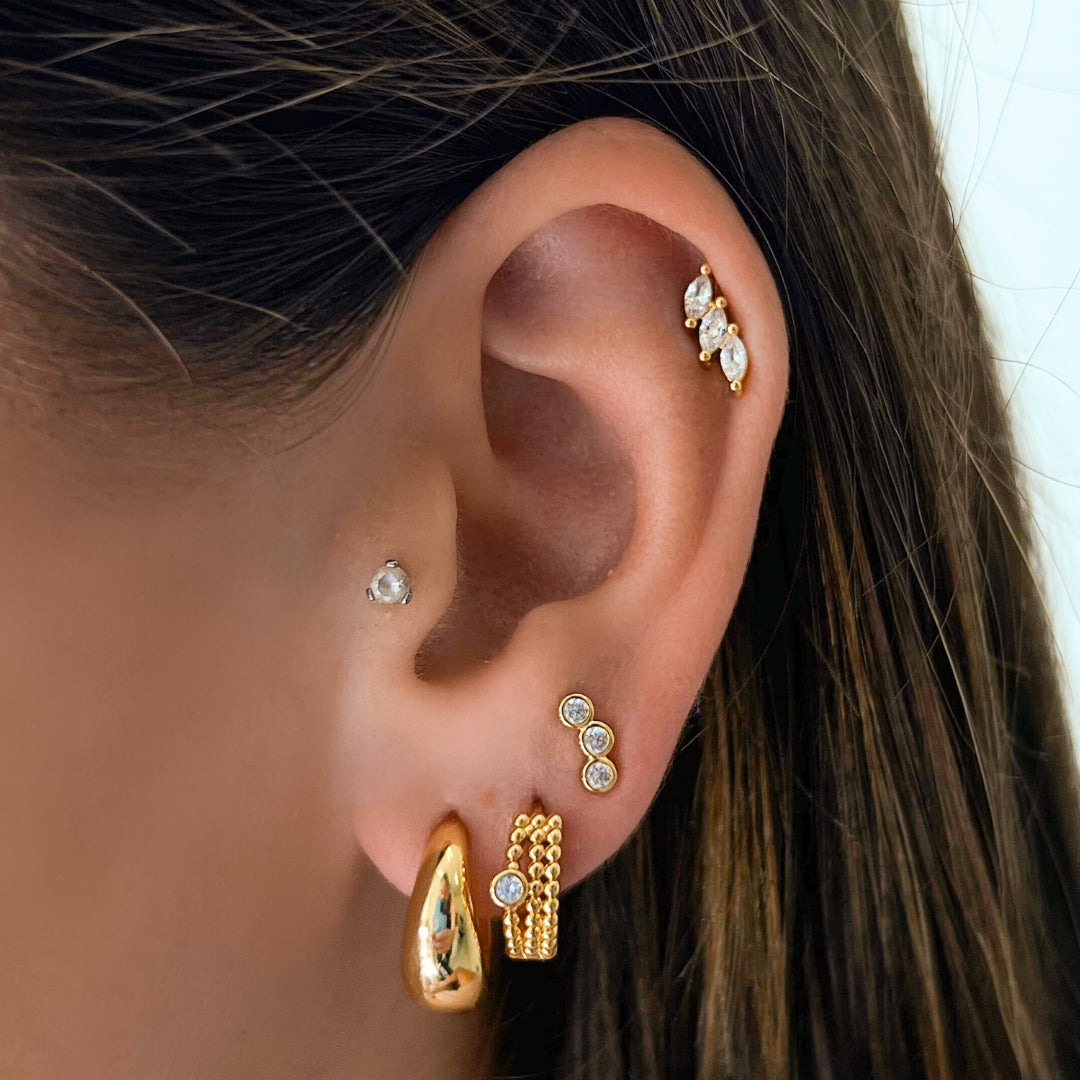 Classic gold hoop earrings in two sizes with polished finish