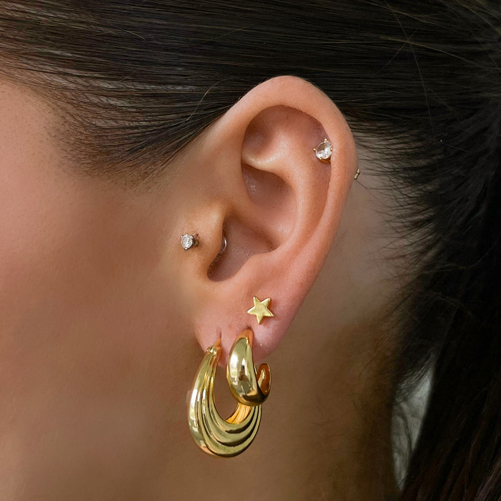 Classic gold hoop earrings in two sizes with polished finish