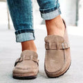Taupe backless clogs with closed toe and adjustable buckle strap